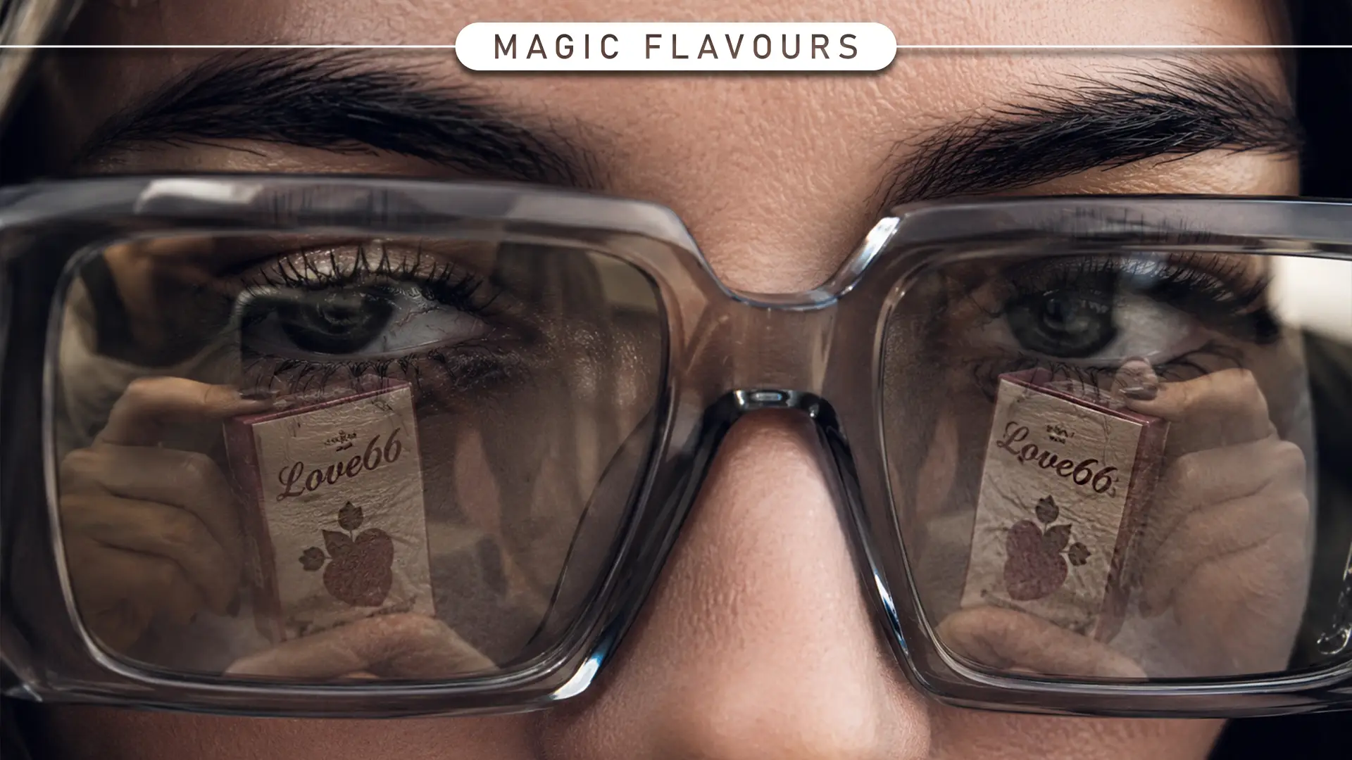 Close-up of a person wearing glasses with the Love66 shisha flavour pack reflected in the lenses for a case study.