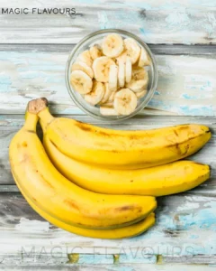 banana fruit beside chopped banana in the bowl