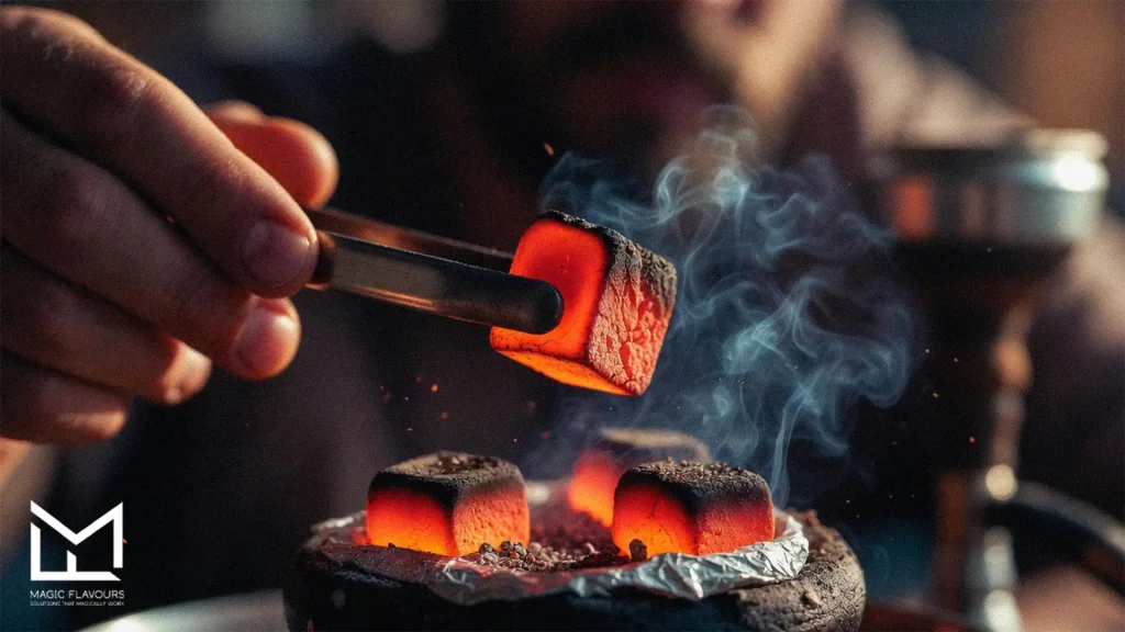 man putting coal on the hookah 