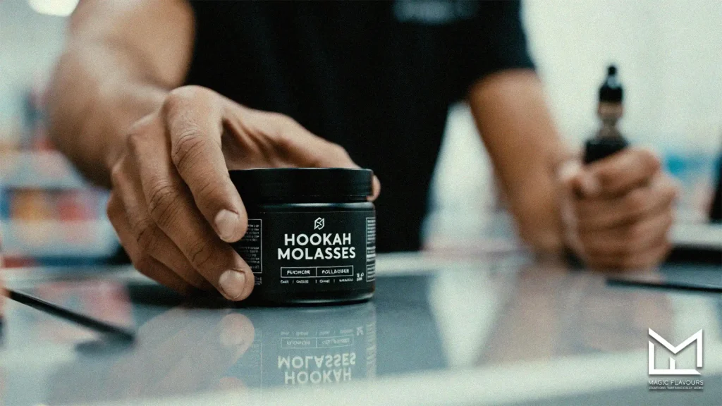 a man holding the shisha moassel in his hand