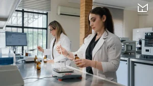Professional team testing and formulating custom flavors in a modern laboratory